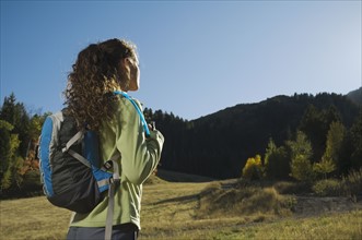 Woman wearing backpack outdoors, Utah, United States. Date : 2007