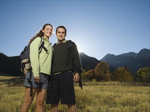 Couple wearing backpacks outdoors, Utah, United States. Date : 2007