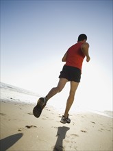 Man jogging on beach. Date : 2007