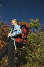 Low angle view of female hiker, Utah, United States. Date : 2007