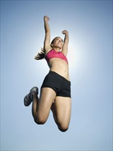 Woman in athletic gear jumping. Date : 2007
