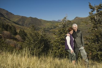 Senior couple hugging outdoors, Utah, United States. Date : 2007