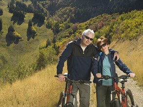 Senior couple with mountain bikes, Utah, United States. Date : 2007