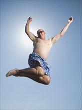 Man in bathing suit jumping. Date : 2007