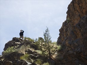 Man standing on cliff. Date : 2007