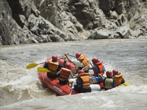 Group of people river rafting. Date : 2007