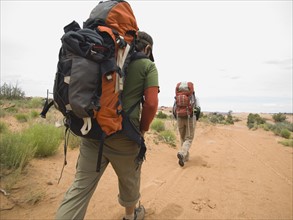 People hiking in desert. Date : 2007