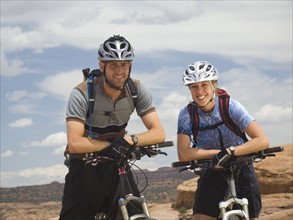 Couple sitting on mountain bikes. Date : 2007