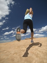 Low angle view of woman jogging. Date : 2007