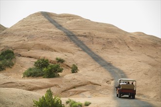 Off-road vehicle driving on rock formation. Date : 2007