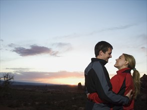 Couple in desert at dusk. Date : 2007