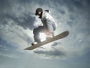Low angle view of snowboarder. Date : 2007