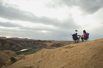 Couple in camping chairs over-looking canyon. Date : 2007
