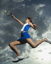 Low angle view of tennis player jumping. Date : 2007