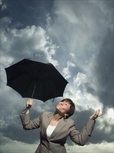 Businesswoman holding umbrella. Date : 2007