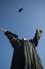Male graduate throwing cap in air. Date : 2007