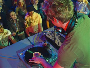 DJ playing in front of crowd. Date : 2007