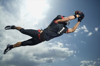Low angle view of football player jumping. Date : 2007