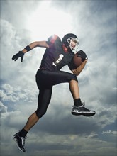 Low angle view of football player jumping. Date : 2007
