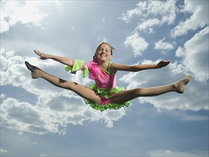 Low angle view of girl jumping. Date : 2007
