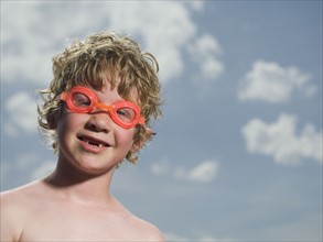 Boy wearing swimming goggles. Date : 2007