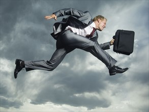Low angle view of businessman jumping. Date : 2007