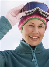 Woman wearing ski goggles.