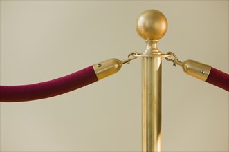 Close up of velvet rope and stanchion.