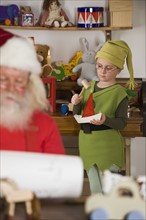 Santa Claus’s elf making toy.