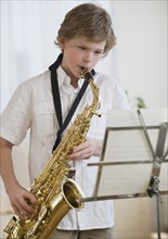 Boy playing saxophone.