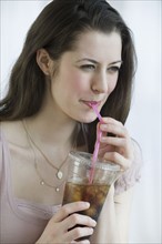 Woman drinking soda.