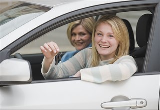 Teenaged girl in car with mother.