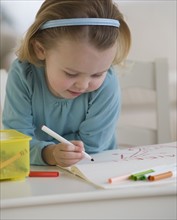 Close up of girl coloring.
