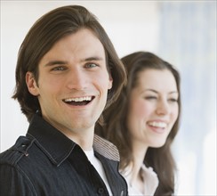 Close up of couple laughing.