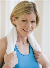 Woman with towel around neck.