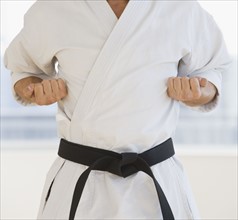 Male karate black belt in fighting stance.