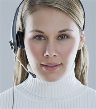 Woman wearing headset.