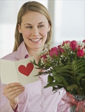 Woman reading Valentine’s Day card.