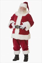 Santa Claus with hands on belly.