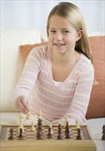 Girl playing chess.