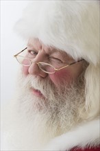 Close up of Santa Claus winking.