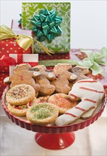Christmas cookies in front of gifts.