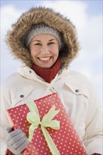 Woman holding gift.