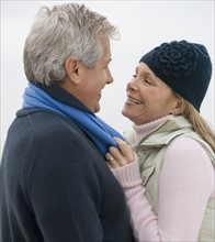 Couple smiling at each other.