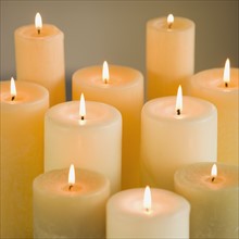 Close up of lit candles.
