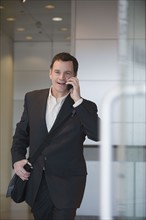 Businessman talking on cell phone.