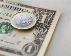 Close up euro coin and us dollar.