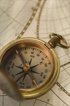 Compass on antique map.