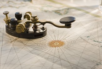 Telegraph key on antique map.