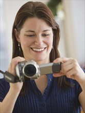 Woman looking at video camera.